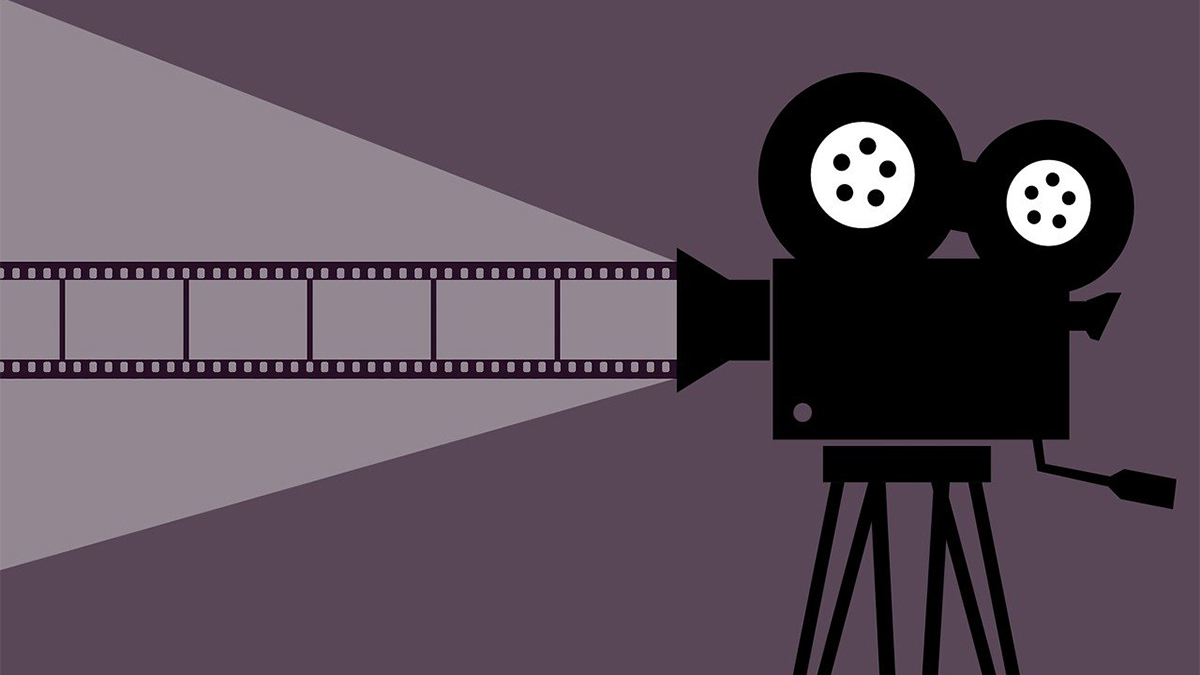 A movie projector with a film stripDescription automatically generated